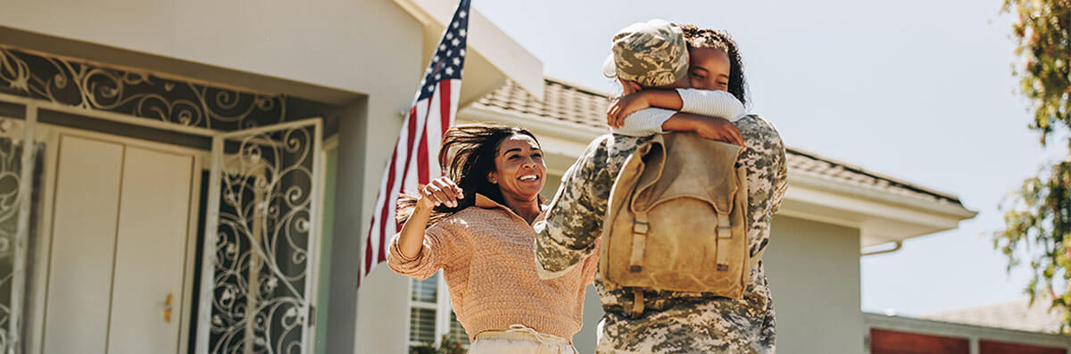 A veteran’s family welcoming him to their new home purchased with a VA mortgage loan