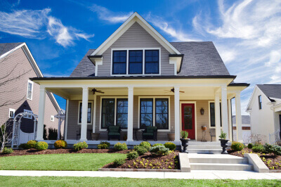 Outside the front of a suburban home purchased using a conventional loan.
