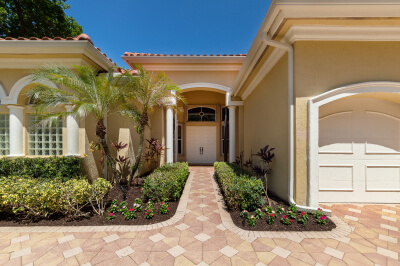 Front entrance to a second mortgage home with palm trees.