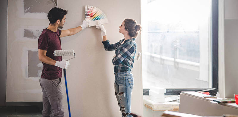 couple choses paint colors for renovating their home